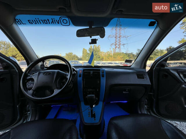 Синий Хендай Туксон, объемом двигателя 2 л и пробегом 317 тыс. км за 9600 $, фото 13 на Automoto.ua