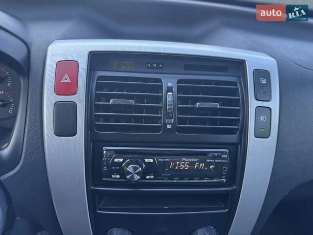 Синий Хендай Туксон, объемом двигателя 1.98 л и пробегом 178 тыс. км за 8700 $, фото 23 на Automoto.ua