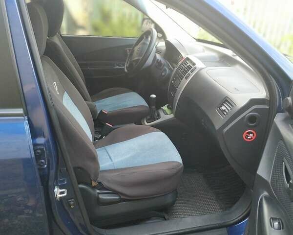 Синий Хендай Туксон, объемом двигателя 2 л и пробегом 200 тыс. км за 7600 $, фото 4 на Automoto.ua