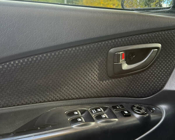 Синий Хендай Туксон, объемом двигателя 1.98 л и пробегом 200 тыс. км за 7700 $, фото 19 на Automoto.ua