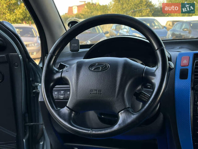 Синий Хендай Туксон, объемом двигателя 2 л и пробегом 317 тыс. км за 9600 $, фото 14 на Automoto.ua