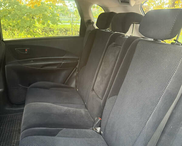 Синий Хендай Туксон, объемом двигателя 1.98 л и пробегом 200 тыс. км за 7700 $, фото 13 на Automoto.ua