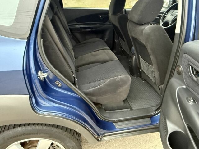 Синий Хендай Туксон, объемом двигателя 2 л и пробегом 279 тыс. км за 6280 $, фото 11 на Automoto.ua