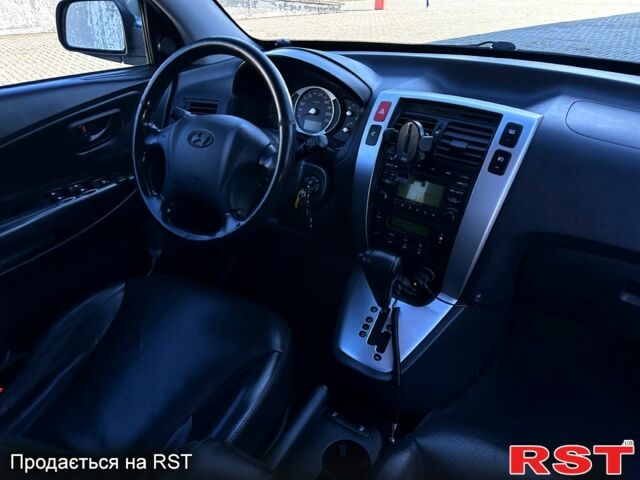 Синий Хендай Туксон, объемом двигателя 2 л и пробегом 233 тыс. км за 8300 $, фото 8 на Automoto.ua