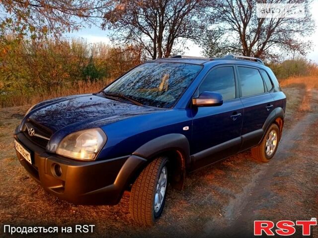 Синий Хендай Туксон, объемом двигателя 2 л и пробегом 220 тыс. км за 8500 $, фото 4 на Automoto.ua