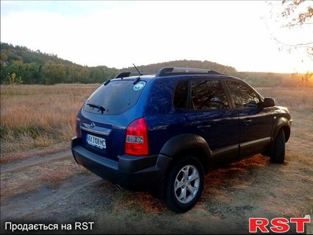 Синий Хендай Туксон, объемом двигателя 2 л и пробегом 220 тыс. км за 8500 $, фото 2 на Automoto.ua