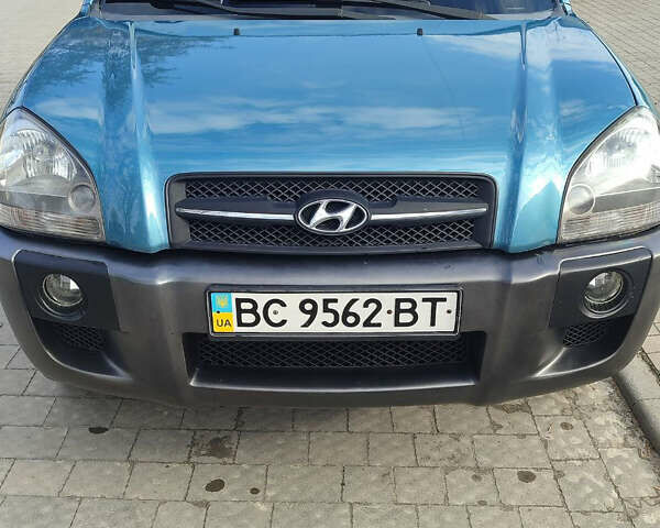 Синій Хендай Туксон, об'ємом двигуна 2 л та пробігом 147 тис. км за 9300 $, фото 11 на Automoto.ua