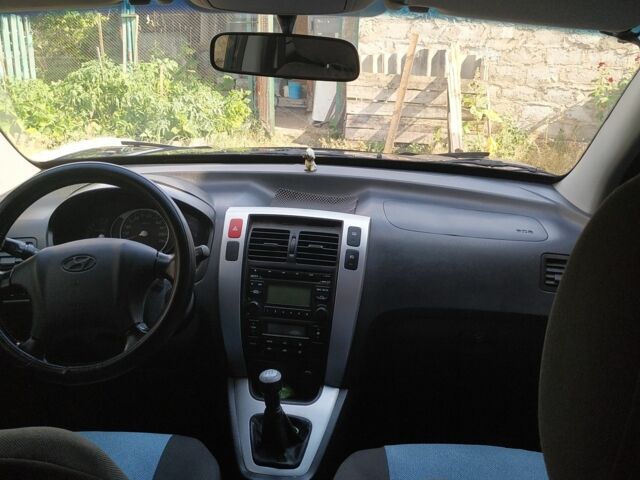 Синий Хендай Туксон, объемом двигателя 2 л и пробегом 200 тыс. км за 8000 $, фото 12 на Automoto.ua