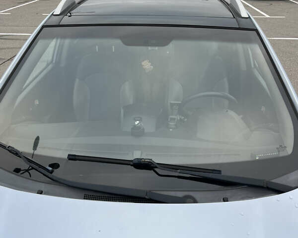 Синий Хендай Туксон, объемом двигателя 2.36 л и пробегом 286 тыс. км за 9800 $, фото 4 на Automoto.ua