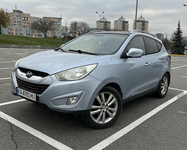 Синий Хендай Туксон, объемом двигателя 2.36 л и пробегом 286 тыс. км за 9800 $, фото 6 на Automoto.ua