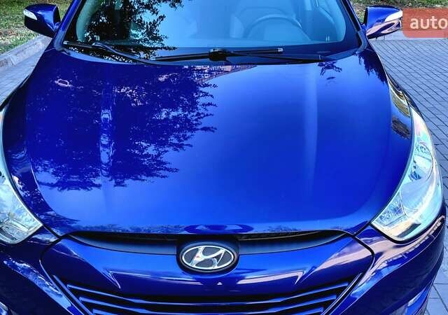 Синий Хендай Туксон, объемом двигателя 2.4 л и пробегом 113 тыс. км за 9600 $, фото 6 на Automoto.ua