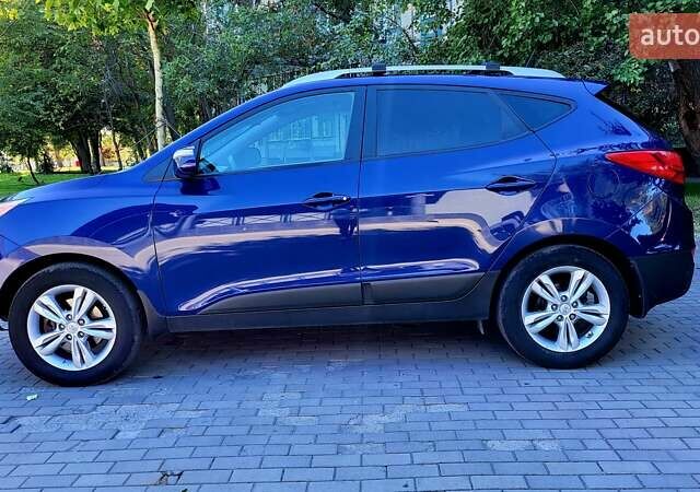 Синий Хендай Туксон, объемом двигателя 2.4 л и пробегом 113 тыс. км за 9600 $, фото 28 на Automoto.ua