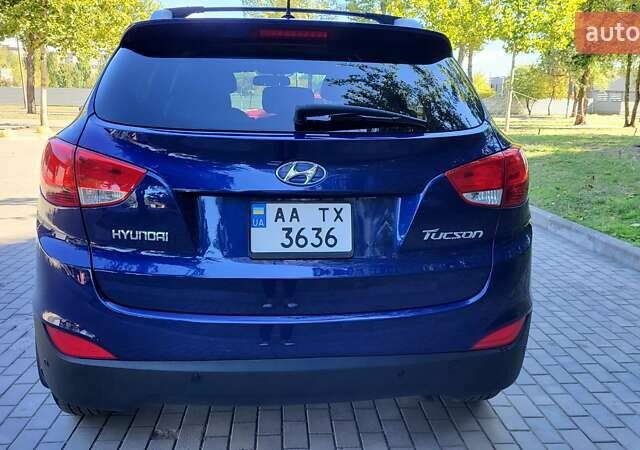 Синий Хендай Туксон, объемом двигателя 2.4 л и пробегом 113 тыс. км за 9600 $, фото 1 на Automoto.ua