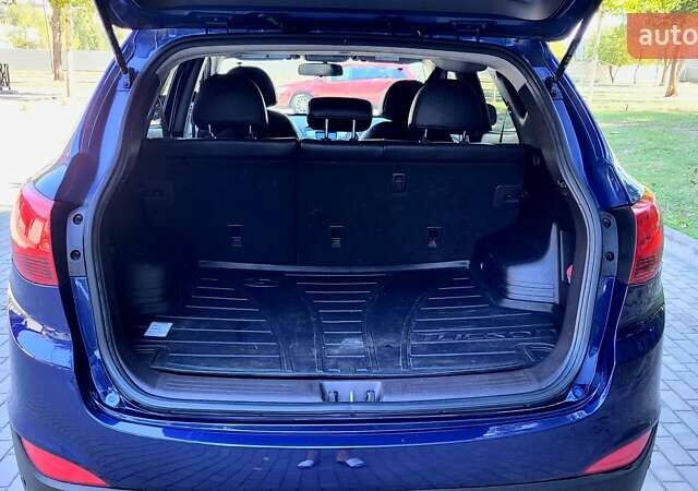 Синий Хендай Туксон, объемом двигателя 2.4 л и пробегом 113 тыс. км за 9600 $, фото 23 на Automoto.ua