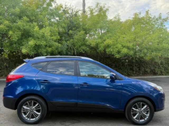 Синий Хендай Туксон, объемом двигателя 2.4 л и пробегом 76 тыс. км за 9600 $, фото 3 на Automoto.ua