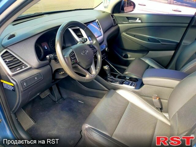 Синий Хендай Туксон, объемом двигателя 2 л и пробегом 198 тыс. км за 15700 $, фото 4 на Automoto.ua