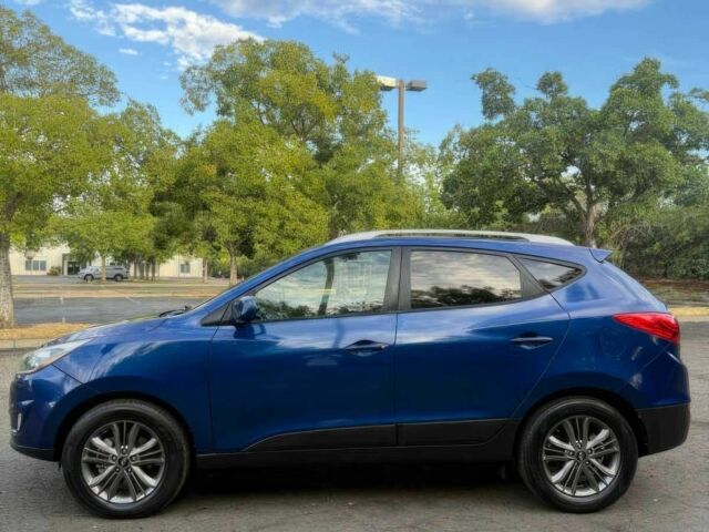 Синий Хендай Туксон, объемом двигателя 2.4 л и пробегом 76 тыс. км за 9600 $, фото 4 на Automoto.ua