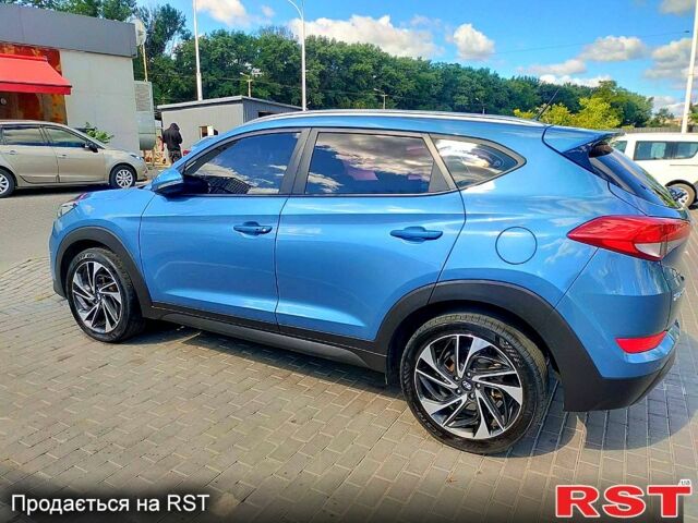 Синий Хендай Туксон, объемом двигателя 2 л и пробегом 198 тыс. км за 15700 $, фото 1 на Automoto.ua