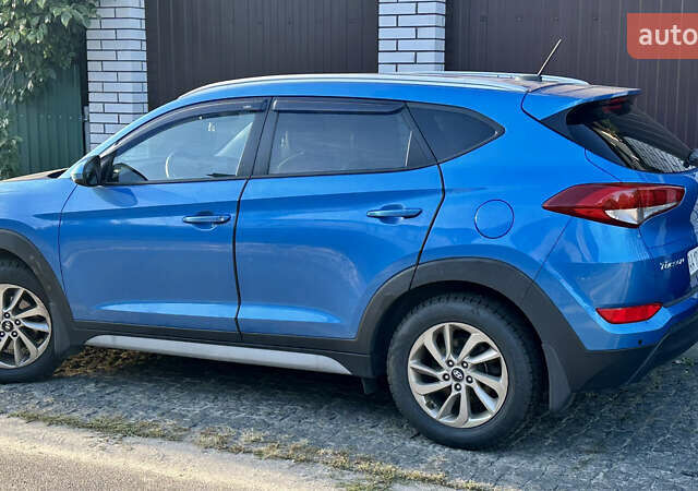 Синий Хендай Туксон, объемом двигателя 2 л и пробегом 37 тыс. км за 17500 $, фото 2 на Automoto.ua
