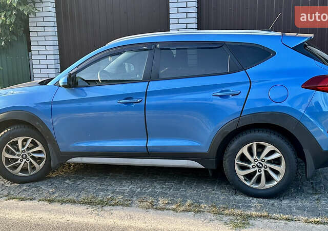 Синий Хендай Туксон, объемом двигателя 2 л и пробегом 37 тыс. км за 17500 $, фото 3 на Automoto.ua