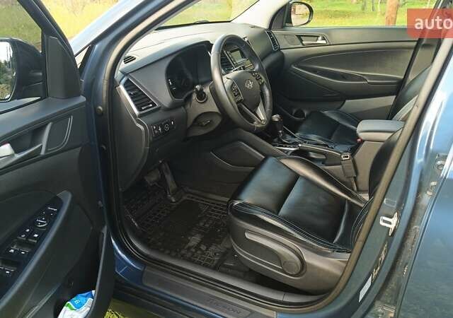 Синий Хендай Туксон, объемом двигателя 2 л и пробегом 83 тыс. км за 17700 $, фото 11 на Automoto.ua