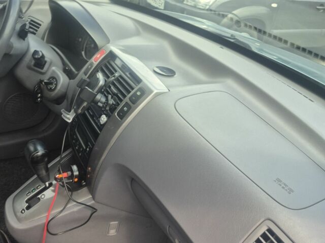 Зеленый Хендай Туксон, объемом двигателя 2 л и пробегом 190 тыс. км за 5000 $, фото 14 на Automoto.ua