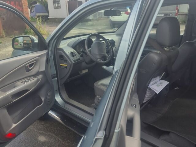 Зеленый Хендай Туксон, объемом двигателя 2 л и пробегом 190 тыс. км за 5000 $, фото 10 на Automoto.ua