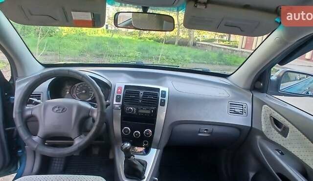 Зеленый Хендай Туксон, объемом двигателя 1.98 л и пробегом 288 тыс. км за 6500 $, фото 14 на Automoto.ua