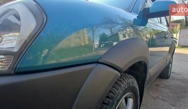 Зеленый Хендай Туксон, объемом двигателя 1.98 л и пробегом 288 тыс. км за 6500 $, фото 9 на Automoto.ua