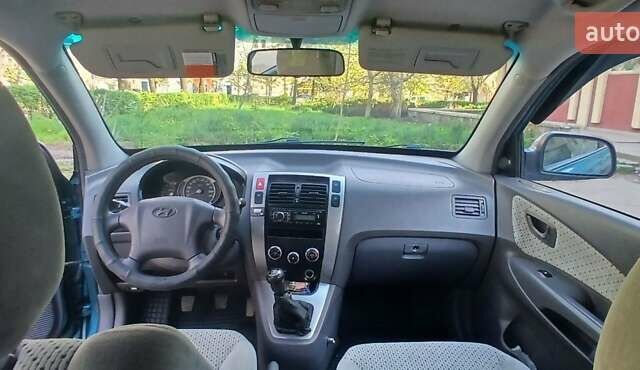 Зеленый Хендай Туксон, объемом двигателя 1.98 л и пробегом 288 тыс. км за 6500 $, фото 10 на Automoto.ua