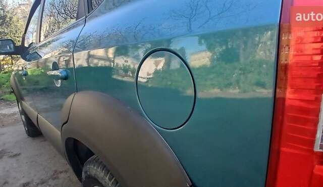 Зеленый Хендай Туксон, объемом двигателя 1.98 л и пробегом 288 тыс. км за 6500 $, фото 11 на Automoto.ua