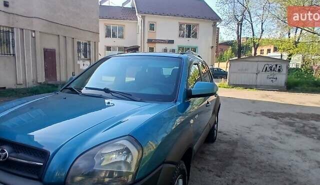 Зеленый Хендай Туксон, объемом двигателя 1.98 л и пробегом 288 тыс. км за 6500 $, фото 6 на Automoto.ua