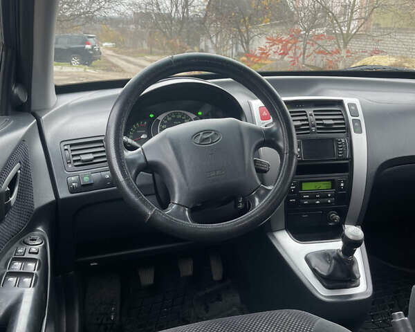 Зеленый Хендай Туксон, объемом двигателя 1.98 л и пробегом 261 тыс. км за 7499 $, фото 113 на Automoto.ua