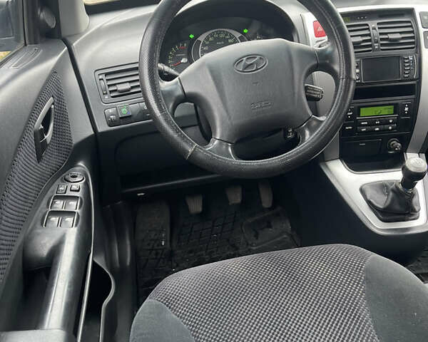 Зеленый Хендай Туксон, объемом двигателя 1.98 л и пробегом 261 тыс. км за 7499 $, фото 112 на Automoto.ua