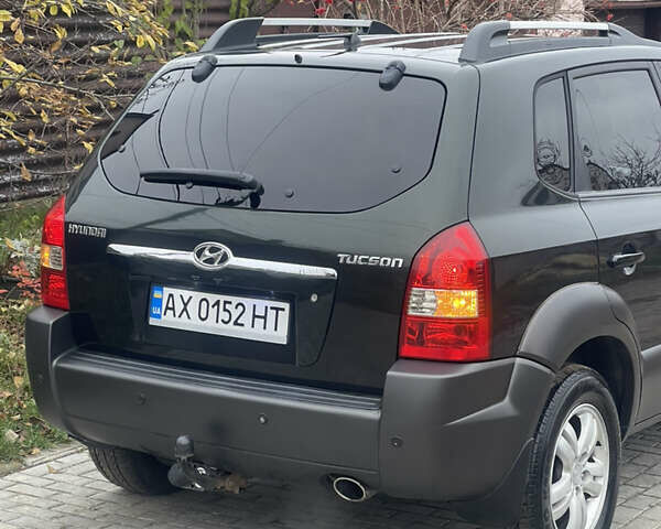 Зеленый Хендай Туксон, объемом двигателя 1.98 л и пробегом 261 тыс. км за 7499 $, фото 23 на Automoto.ua