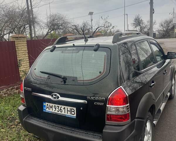 Зеленый Хендай Туксон, объемом двигателя 2 л и пробегом 201 тыс. км за 7600 $, фото 4 на Automoto.ua