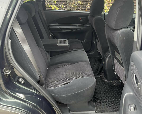 Зеленый Хендай Туксон, объемом двигателя 1.98 л и пробегом 261 тыс. км за 7499 $, фото 126 на Automoto.ua