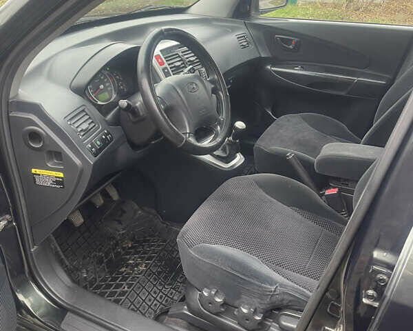 Зеленый Хендай Туксон, объемом двигателя 1.98 л и пробегом 261 тыс. км за 7499 $, фото 96 на Automoto.ua