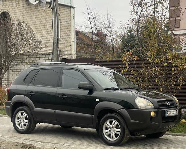 Зеленый Хендай Туксон, объемом двигателя 1.98 л и пробегом 261 тыс. км за 7499 $, фото 44 на Automoto.ua