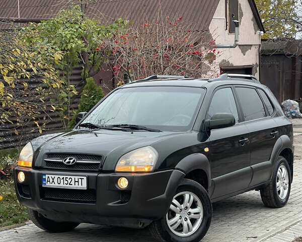 Зеленый Хендай Туксон, объемом двигателя 1.98 л и пробегом 261 тыс. км за 7499 $, фото 12 на Automoto.ua