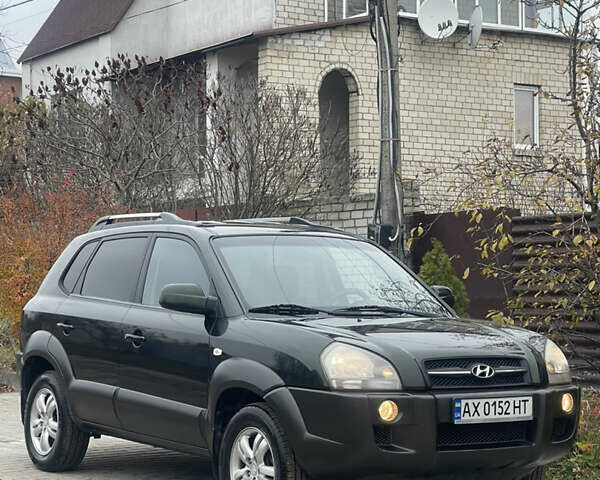 Зеленый Хендай Туксон, объемом двигателя 1.98 л и пробегом 261 тыс. км за 7499 $, фото 43 на Automoto.ua