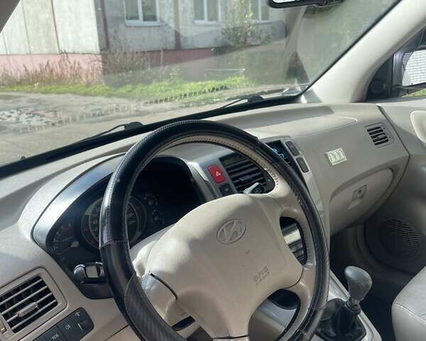 Зеленый Хендай Туксон, объемом двигателя 2 л и пробегом 201 тыс. км за 7600 $, фото 21 на Automoto.ua