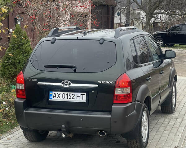 Зеленый Хендай Туксон, объемом двигателя 1.98 л и пробегом 261 тыс. км за 7499 $, фото 49 на Automoto.ua