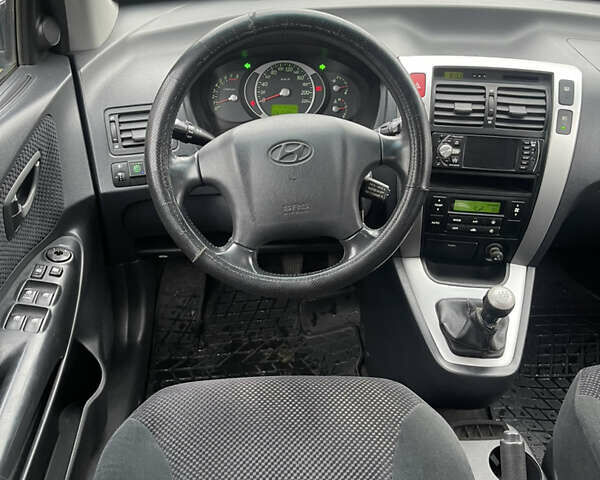 Зеленый Хендай Туксон, объемом двигателя 1.98 л и пробегом 261 тыс. км за 7499 $, фото 114 на Automoto.ua