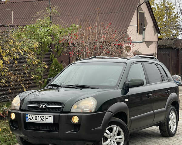 Зеленый Хендай Туксон, объемом двигателя 1.98 л и пробегом 261 тыс. км за 7499 $, фото 13 на Automoto.ua