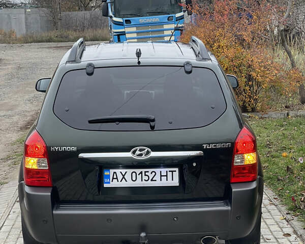 Зеленый Хендай Туксон, объемом двигателя 1.98 л и пробегом 261 тыс. км за 7499 $, фото 15 на Automoto.ua