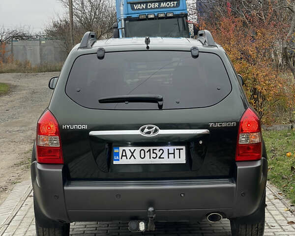 Зеленый Хендай Туксон, объемом двигателя 1.98 л и пробегом 261 тыс. км за 7499 $, фото 18 на Automoto.ua