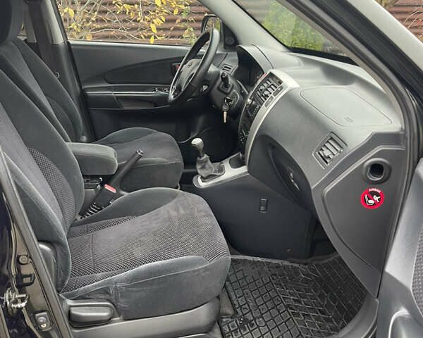 Зеленый Хендай Туксон, объемом двигателя 1.98 л и пробегом 261 тыс. км за 7499 $, фото 132 на Automoto.ua