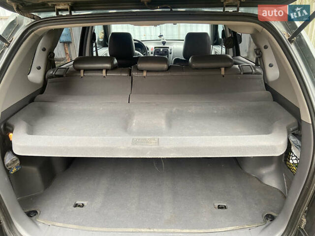 Зеленый Хендай Туксон, объемом двигателя 1.98 л и пробегом 200 тыс. км за 8500 $, фото 21 на Automoto.ua