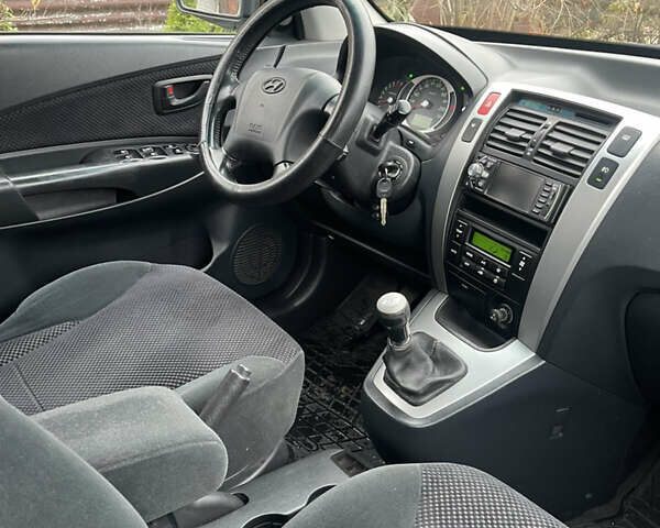 Зеленый Хендай Туксон, объемом двигателя 1.98 л и пробегом 261 тыс. км за 7499 $, фото 129 на Automoto.ua